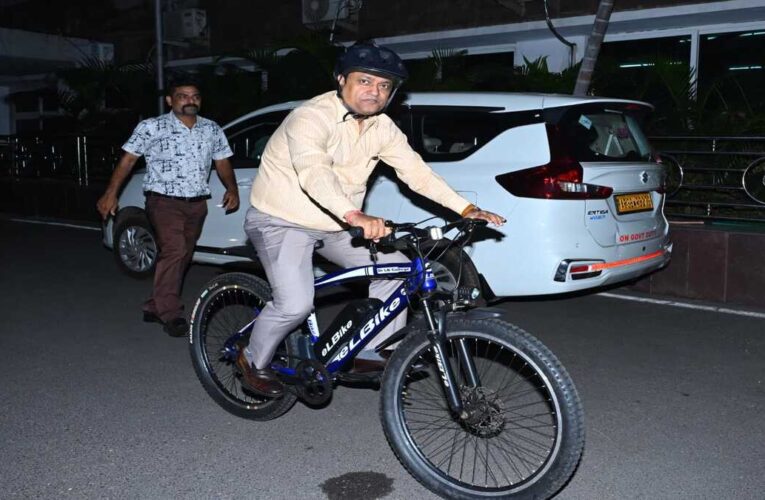 DRM cycles to office on e-bike, urges staff to adopt green mobility