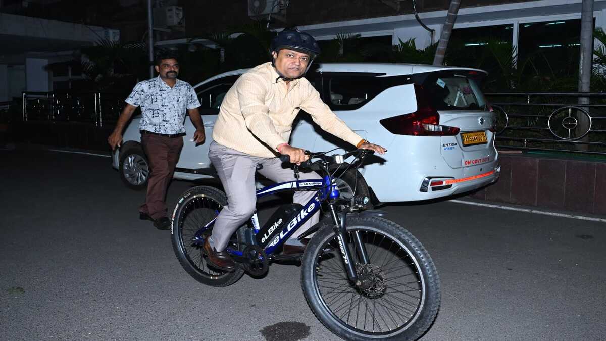 DRM cycles to office on e-bike, urges staff to adopt green mobility